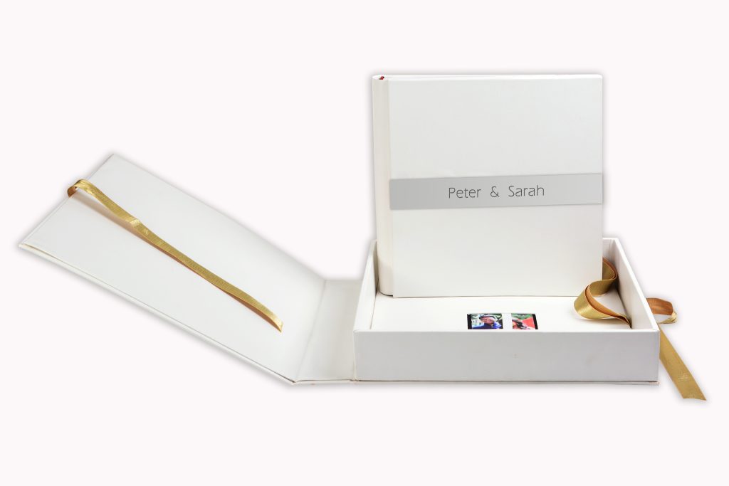 people holding umbrellas on a busy street at night lit by street lights and illuminated signs in Tokyo, Japan