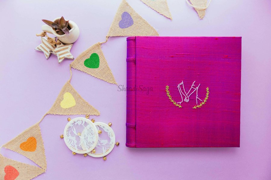 car interior from central back seat position showing driver and blurred view through windscreen of a busy road at night