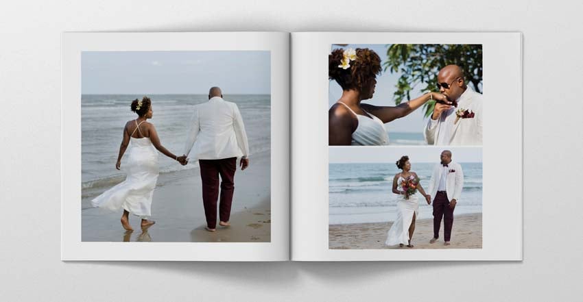 man wearing a black jacket, white shirt, blue jeans, and brown boots, playing a white electric guitar while sitting on an amp