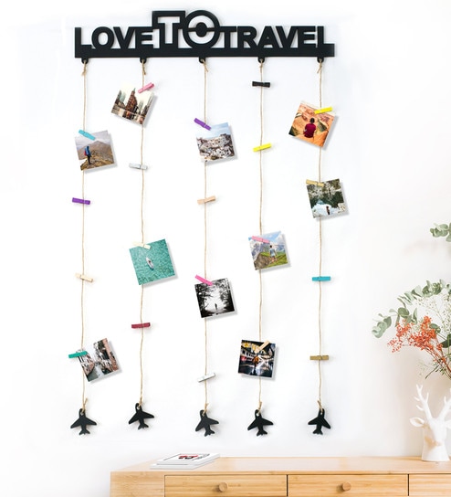 people holding umbrellas on a busy street at night lit by street lights and illuminated signs in Tokyo, Japan